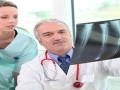 Doctor and Assistant Reviewing X-Ray