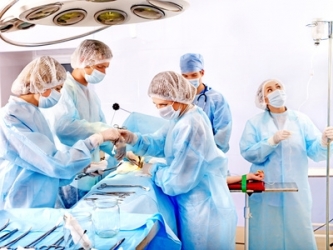 Surgeon at work in operating room.