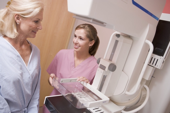 Nurse Assisting Patient About To Have A Mammogram