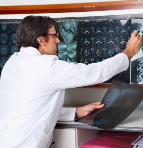 Radiologist Reviewing X-ray At Clinic