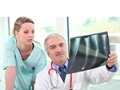 Doctor and Assistant Reviewing X-Ray