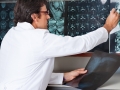 Radiologist Reviewing X-ray At Clinic